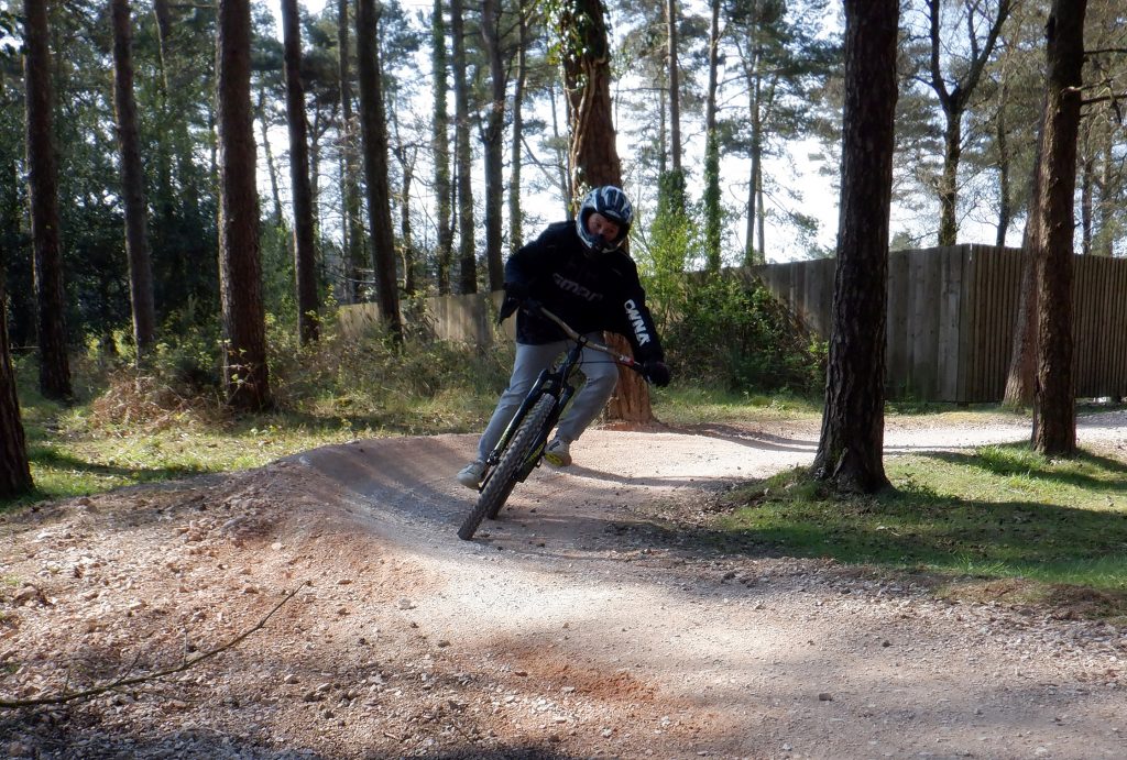 student mountain biking on his bike