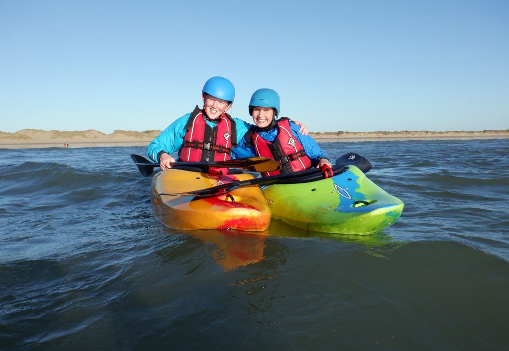 2 students in canoes