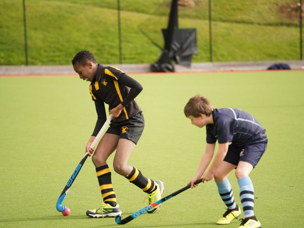 Students passing the hockey ball