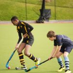 Students passing the hockey ball