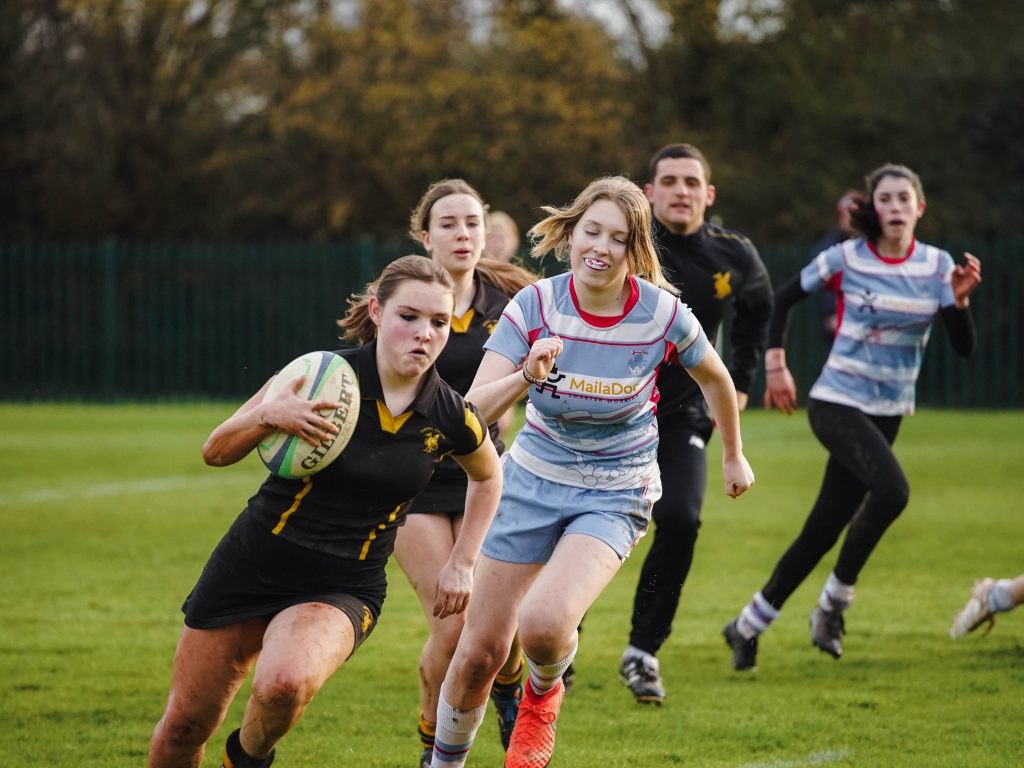 Students playing rugby