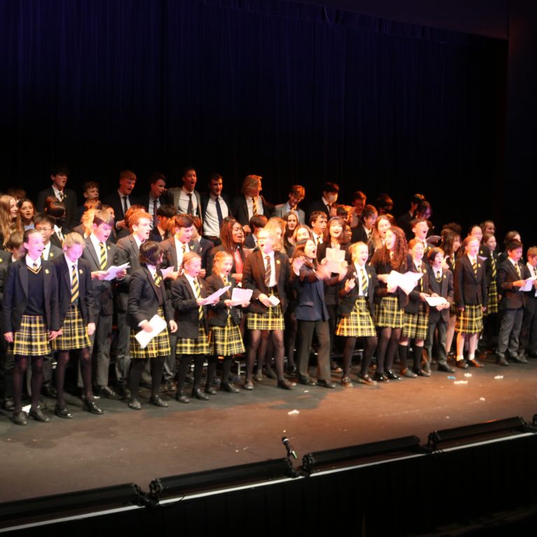 Students singing on the stage