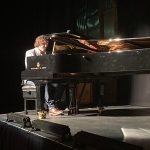 Jay Rayner playing piano