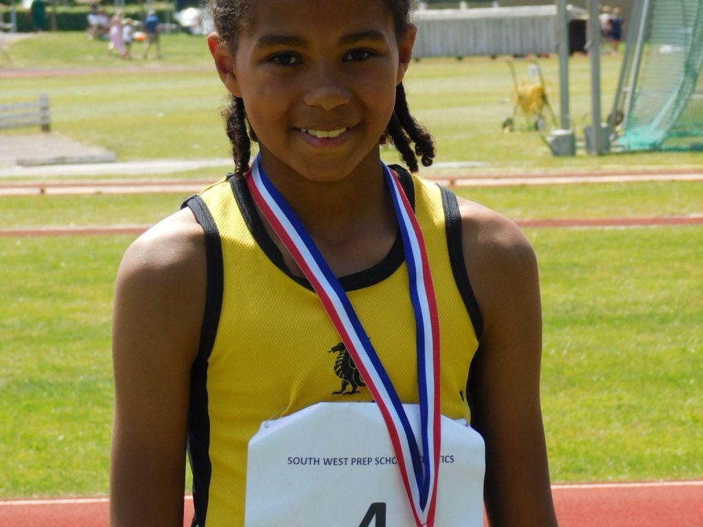 Smiling student with medal