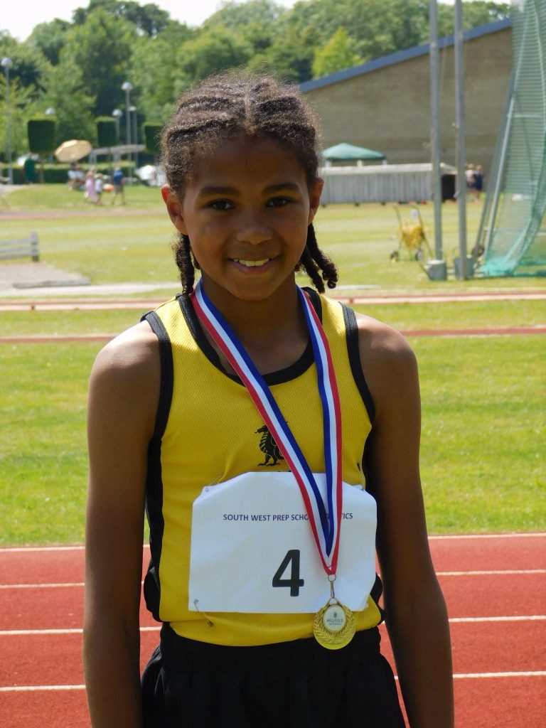 Smiling student with medal