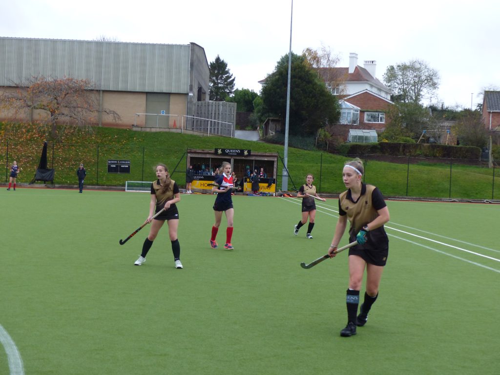 girls playing hockey