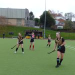 girls playing hockey