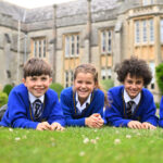 Queen's College Prep pupils gathered on the front lawn