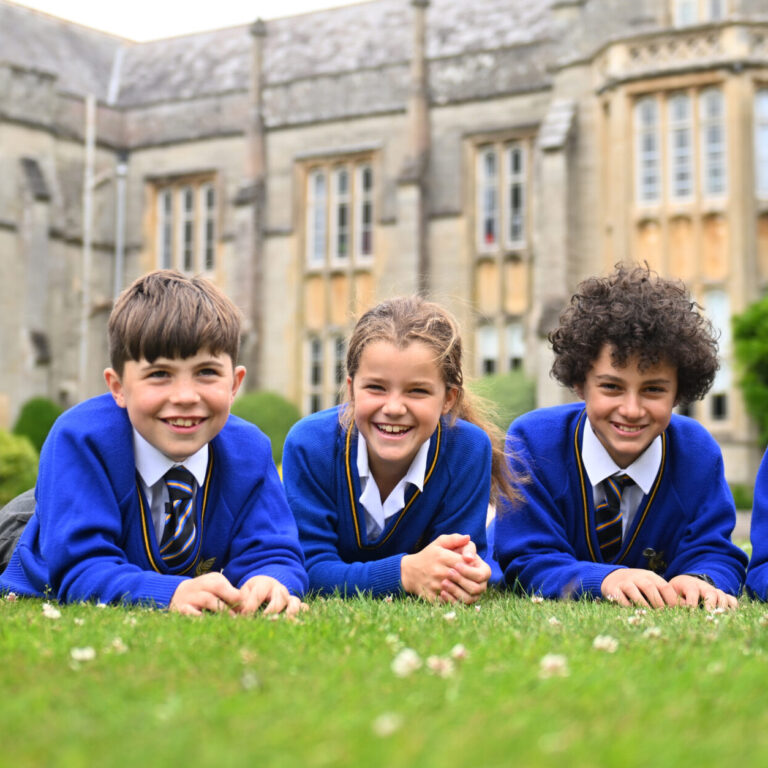 Queen's College Prep pupils gathered on the front lawn