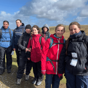 7 children on Dartmoor wearing hiking gear.