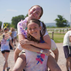 Queen's College pupils participating in a local colour run
