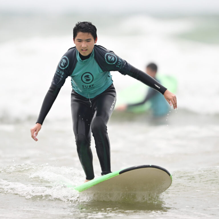 Queen's College Taunton pupil surfing