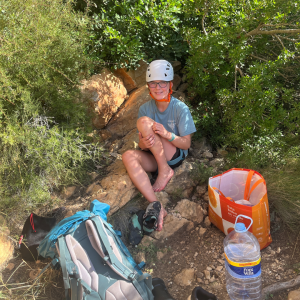 One girl resting on a rock.