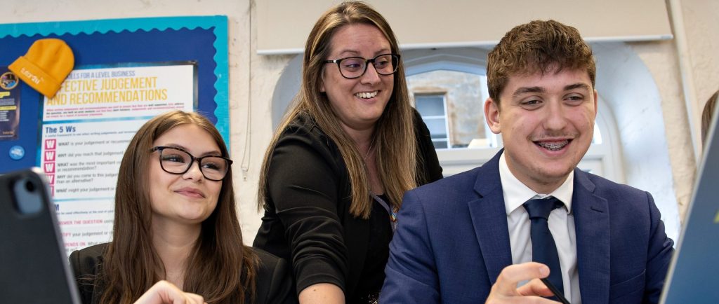 A teacher and two sixth formers discussing Ai.