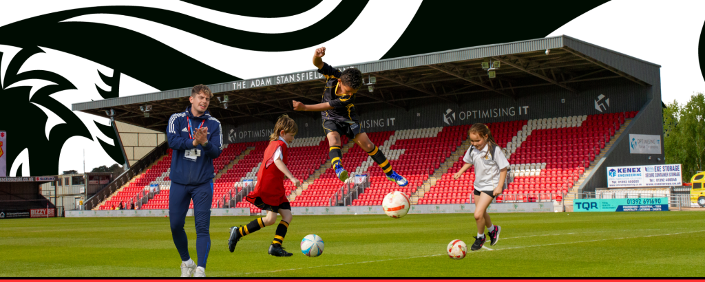 Queen’s College Taunton representing its partnership with Exeter City FC Community Trust, highlighting education, sport, and community collaboration in a welcoming Taunton Independent school environment. Somerset Football Schools.